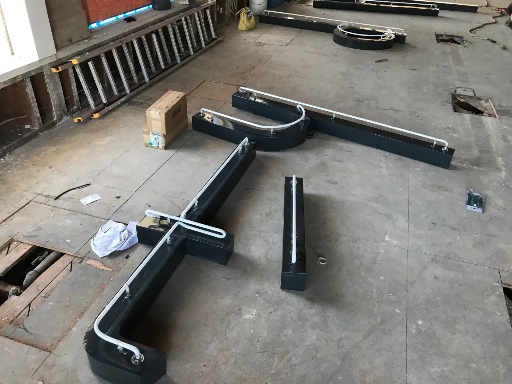 Vintage Food City letters await installation